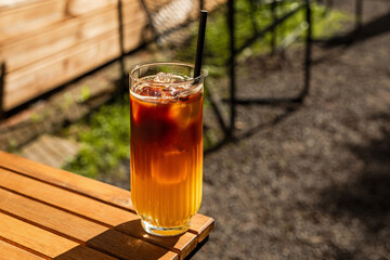 Bumble cold coffee drink, espresso and orange juice, on the terrace of a cafe