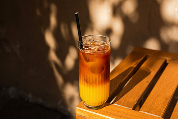 Bumble cold coffee drink, espresso and orange juice, on the terrace of a cafe