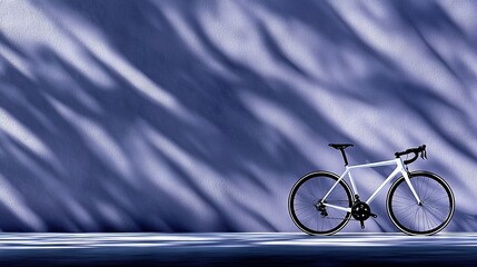 Fototapeta premium Blue wall with bike shadow in black and white