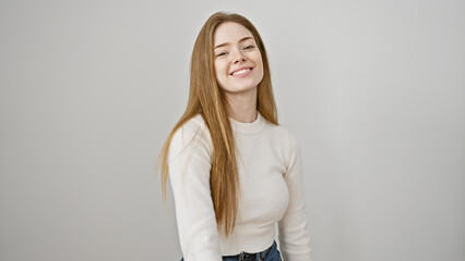 Smiling young caucasian woman with blonde hair, isolated on a white background, portraying natural beauty and happiness.