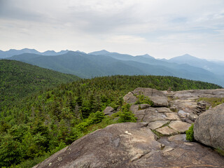 Summit of Cascade Mountain, Lake Placid, New York State, with rocks, small cairns and surrounding Adirondack landscape. © Karlsson Photo