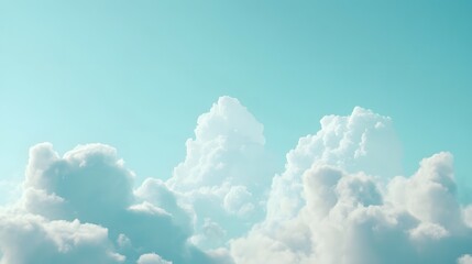 A serene sky filled with fluffy white clouds against a light blue backdrop evokes tranquility and openness. 