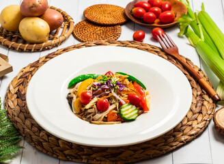 Colorful Vegetable tomato Pasta Salad include cucumber, carrots, bell peppers, mushrooms, and cherry tomatoes in plate isolated on table side view of taiwan food