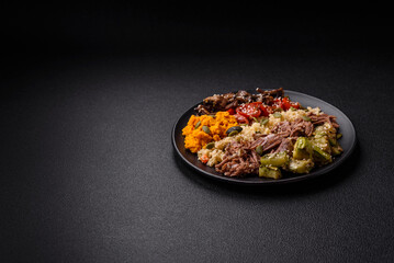 Bowl of food with beef, bulgur, tomatoes, mushrooms, zucchini