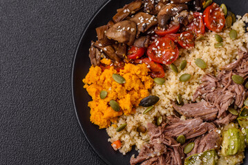 Bowl of food with beef, bulgur, tomatoes, mushrooms, zucchini