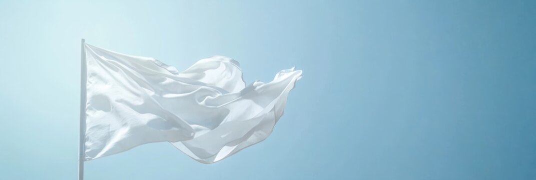 White flag waving against a blue sky. International Day of Neutrality. Horizontal banner. Free space for text. Resolving international conflicts by peaceful means, stop war concept. World Peace Day