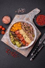 Bowl of food with beef, bulgur, tomatoes, mushrooms, zucchini