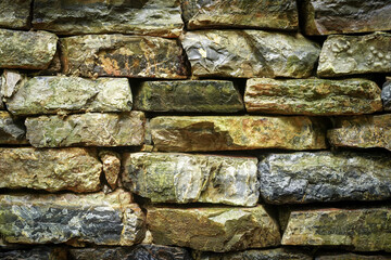 Many different size of rectangle brown grey stone wall for abstract background and texture for interior or exterior design. Beautiful patterns, space for work, banner, wallpaper close up.