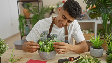 A smiling young man arranging succulents in a modern florist shop, exuding a hobbyist's joy amidst...