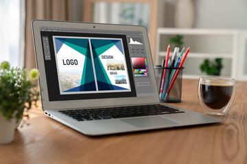 Graphic designer software for modern design of web page and commercial ads showing on the computer screen