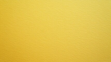 Fototapeta premium A close-up view of a textured yellow wall illuminated by soft natural light