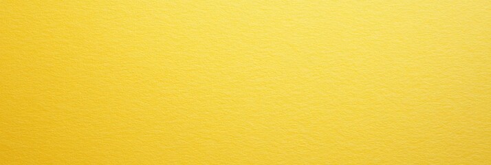 Obraz premium Bright yellow wall background illuminated by soft light in a minimalist indoor setting