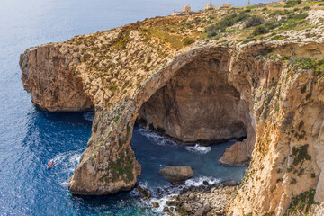 Malta. The Blue Grotto, seen from above. Small tour boat.