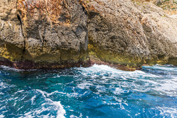 Malta, Blue Grotto. Blue waters of the Mediterranean seen from a tour boat.