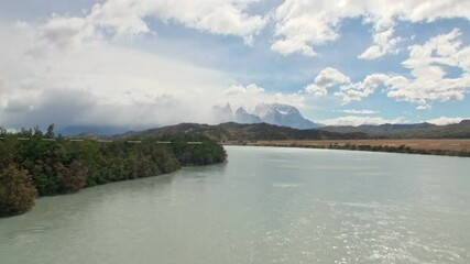 Breathtaking view of winding river in Patagonia, Argentina, captures essence of outdoor adventures and natural beauty, making it ideal destination for exploration and memorable experiences