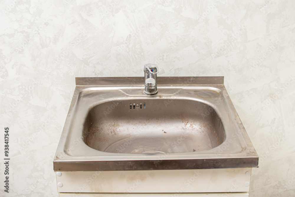 Wall mural Dirty sink with rust. Kitchen sink overhead metal