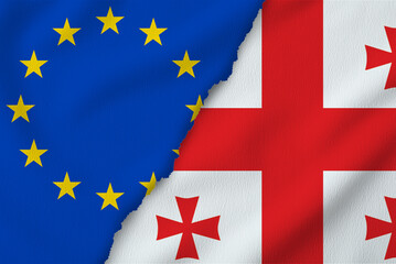 Flags of European Union and Georgia on torn papers