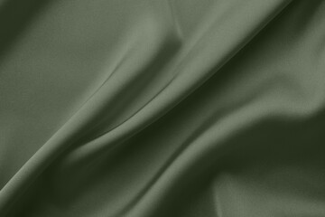 Crumpled sage color silk fabric as background, top view
