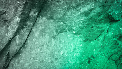 A 4K background featuring a natural granite stone texture in a gradient of vibrant green hues. Ideal for eco-themed designs, wallpapers, and nature-inspired backdrops