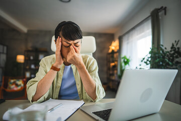mature japanese woman have eyestrain while work from home