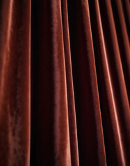 Fototapeta premium Curtain with soft smooth flowing folds. Deep brown color and luxurious texture create a dramatic and elegant atmosphere. Decoration and interior design. Expensive curtain made of rich fabric. AI