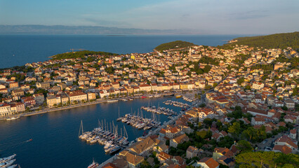 Naklejka premium Aerial view of Mali Losinj with the setting sun, Croatia