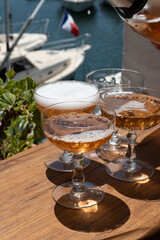 Summer party, French brut rose champagne sparkling wine in coupe glasses in yacht harbour of Port Grimaud near Saint-Tropez, French Riviera vacation, Var, France
