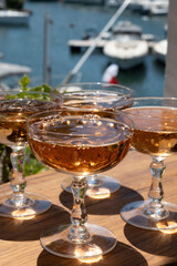 Summer party, French brut rose champagne sparkling wine in coupe glasses in yacht harbour of Port Grimaud near Saint-Tropez, French Riviera vacation, Var, France