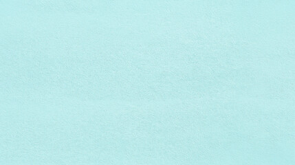 a seamless texture of slightly textured colored paper in pastel aqua marine color