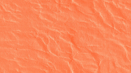 a seamless texture of slightly textured colored paper in pastel orange color
