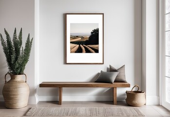 Wooden bench against white wall with poster frame. Ethnic farmhouse interior design of modern entrance hall