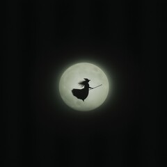 Silhouette of a Witch Flying on a Broomstick in Front of a Full Moon
