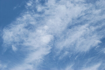 gentle white clouds in the blue sky