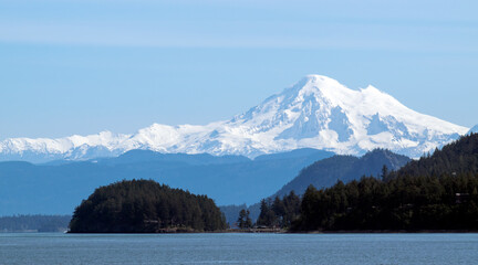 Panoramic view of Puget Sound and the snow-capped North Cascades with Mount Baker seen from a ferry. © Ute Sonja Medley