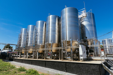 Modern winery production line. Large tanks for fermentation