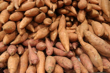 A pile of sweet potatoes for sale
