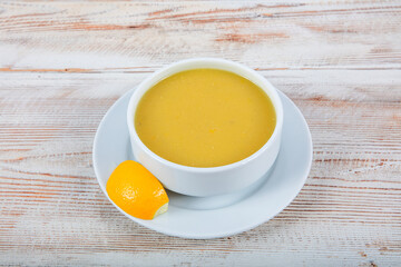 Turkish cuisine Lentil soup, melted butter and red pepper sauce. Served with bread and lemon. Local name; suzme mercimek corbasi.