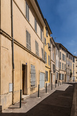 typical old facade in Aix en provence with ochre painted facades