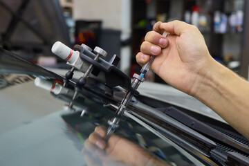 Installing windshield on a car with automotive design