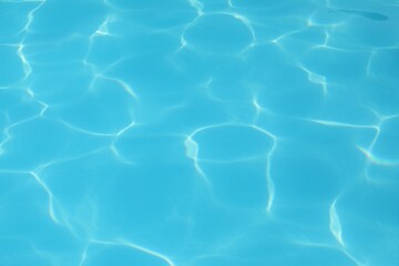 Clear water in outdoor swimming pool on sunny day