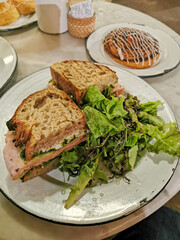 sandwich and a cinnamon roll