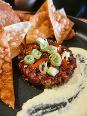 beef tartar and crispy wontons
