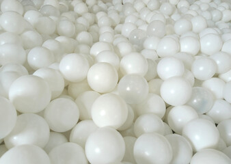 A pattern of white balls stacked in a pond