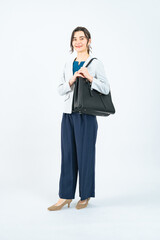 Full-body photo of a Caucasian female business person standing in front of a white background