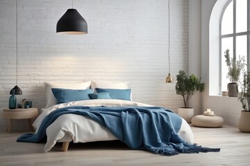 Bed with blue pillows and blanket by the fireplace facing the white brick wall. Loft, Scandinavian interior design modern bedroom