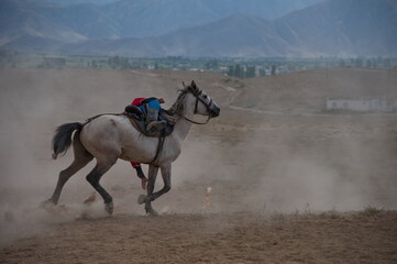 Kyrgyz nomad showing his riding skills