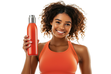 A cheerful woman in athletic wear holding a red stainless steel water bottle, promoting hydration and healthy lifestyle.