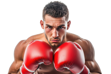 A determined boxer poses fiercely, showcasing strength and focus with red gloves and an intense expression.