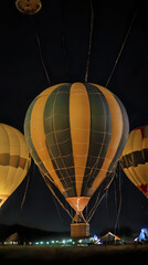 Obraz premium several hot air balloons are lit up at night in a field