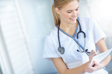 Healthcare, paper and smile with nurse woman in hospital for medical insurance, notes or results. Checklist, documents and writing with happy medicine professional in clinic for administration